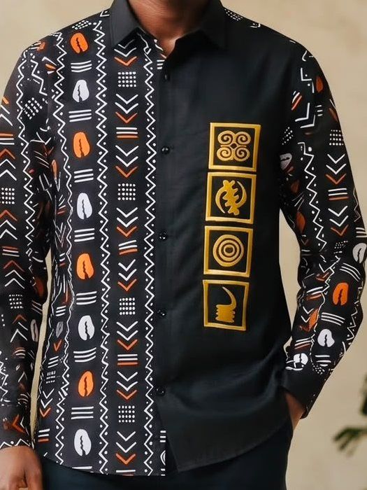 Black long-sleeve shirt with African print panel and gold Adinkra symbol embroidery