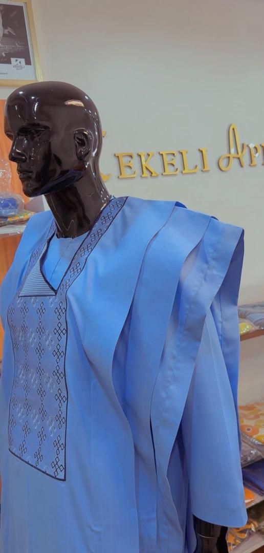 Light blue agbada set with embroidered chest panel on a mannequin